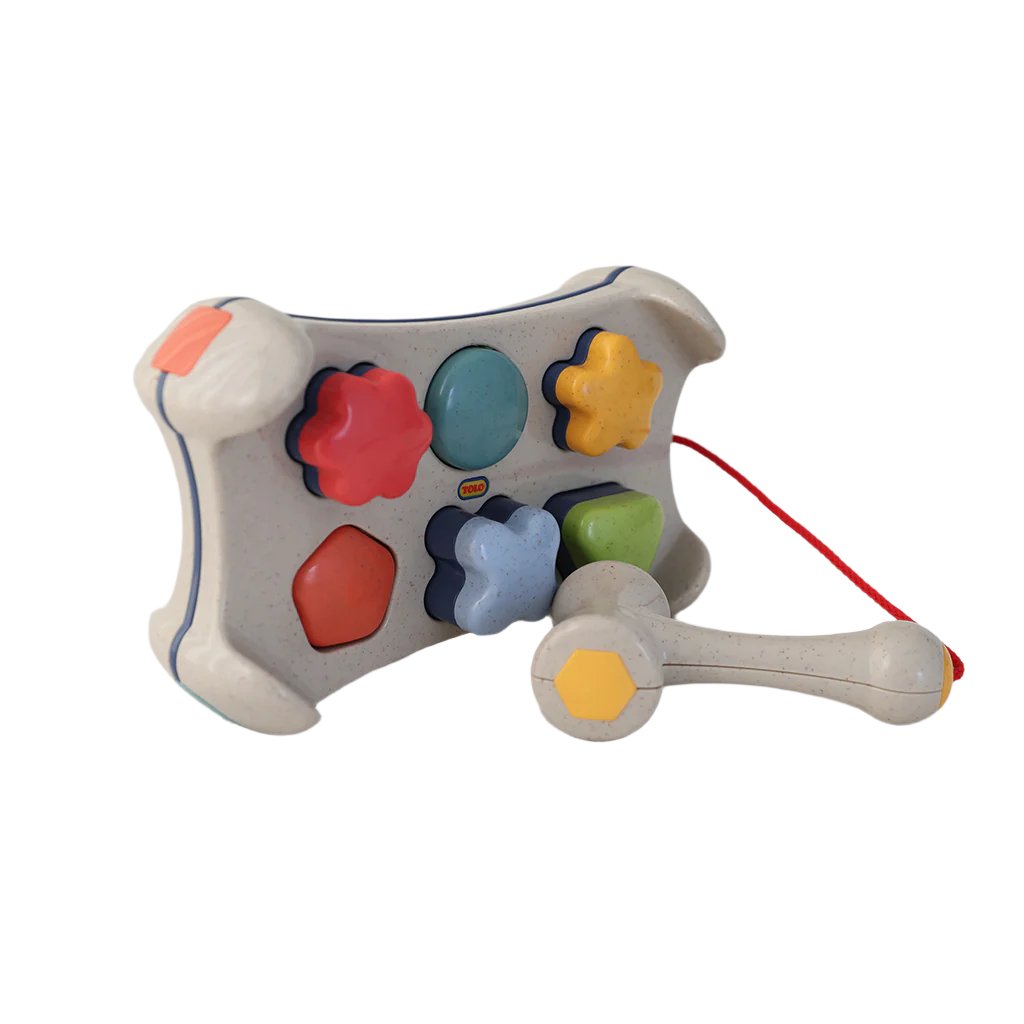 Tolo, Hammerbræt og puttekasse i ét