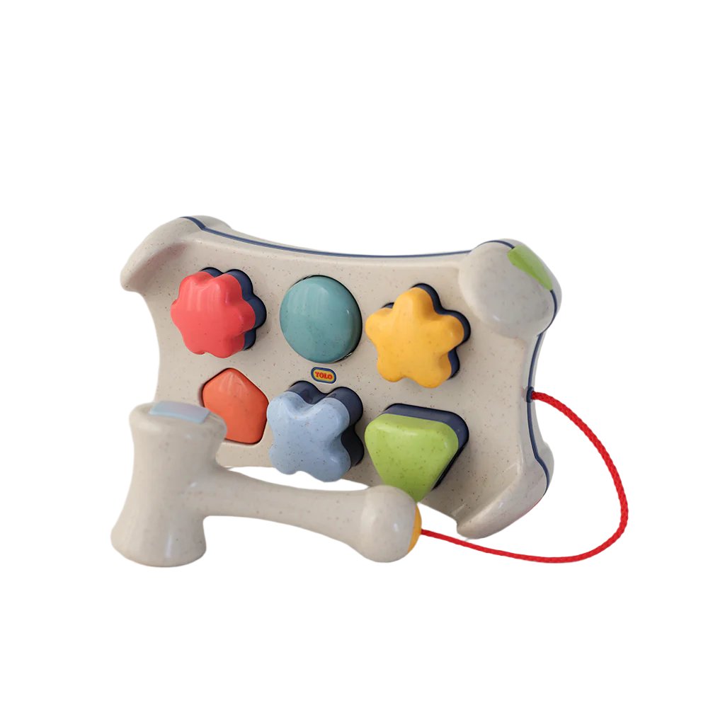 Tolo, Hammerbræt og puttekasse i ét